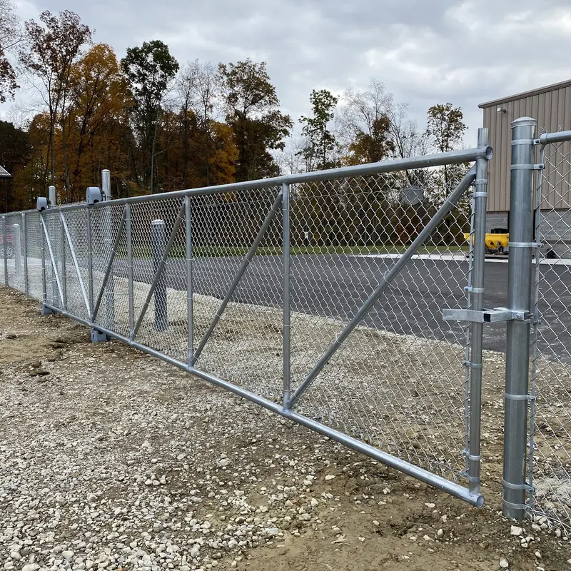 Galvanized cantilever chain link slide gate at a commercial entrance