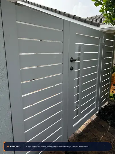Custom white horizontal-slat aluminum gate with matching semi-privacy fence panels in Palm Beach County, Florida
