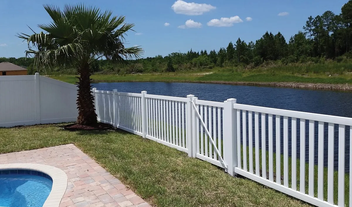 Closed picket vinyl fence installed in South Florida — white traditional style