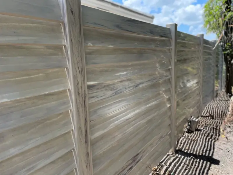 Woodgrain and Dark Sequoia vinyl fence texture close-up